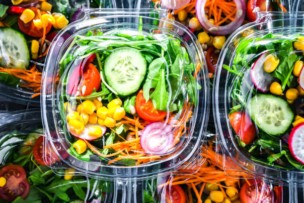 istock Boxes with pre-packaged vegetable salads in a commercial fridge 1484753862