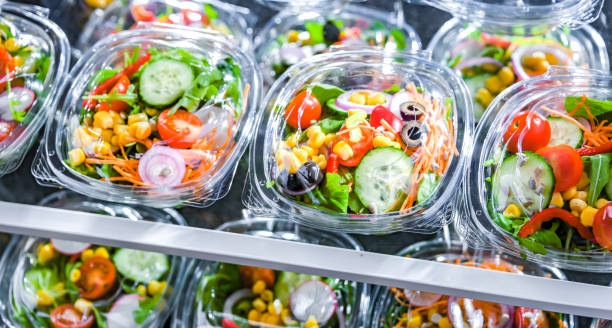 istock Boxes with pre-packaged vegetable salads in a commercial fridge 1484753911