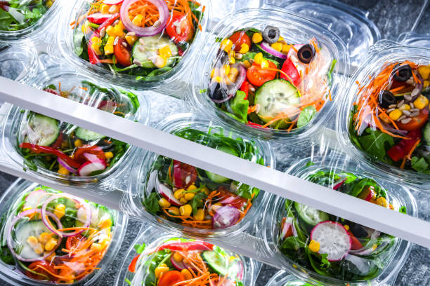 istock Boxes with pre-packaged vegetable salads in a commercial fridge 1484753964