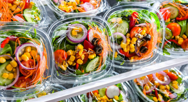 istock Boxes with pre-packaged vegetable salads in a commercial fridge 1484753998