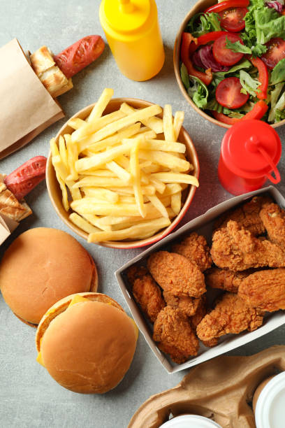 Tasty fast food on gray textured table