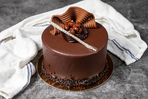 Chocolate cream cake. Chocolate birthday cake on dark background. patisserie desserts