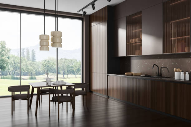 istock Brown kitchen interior with eating and cooking corner near panoramic window 1484759291