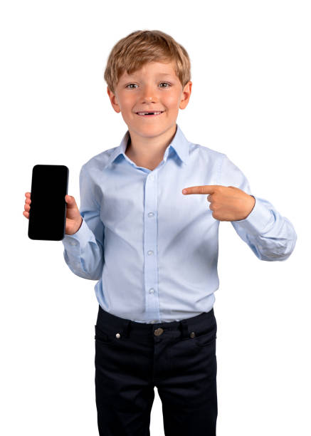 istock Smiling boy pointing to the smartphone in hand, isolated over white background 1484762595
