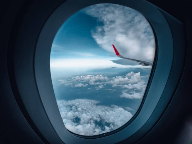istock The airplane flew over the clouds. 1484763583