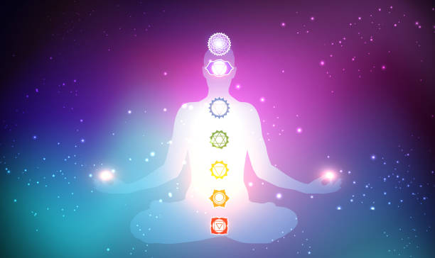 istock Human sitting in yoga lotus pose and connection to meditative space 1484769332