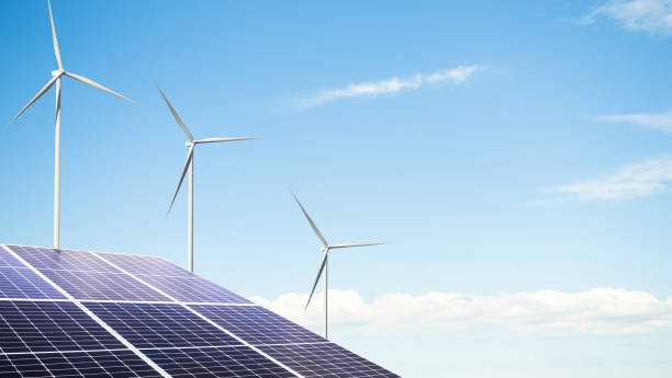 istock Wind Mill Power Energy Farm with Solar Panel Turbine Cell on Blue Sky Background,Plant Renewable Field Generator windfarm,turbine Electric Sustainable Station Climate Electricity,Eco Environment 1484771349