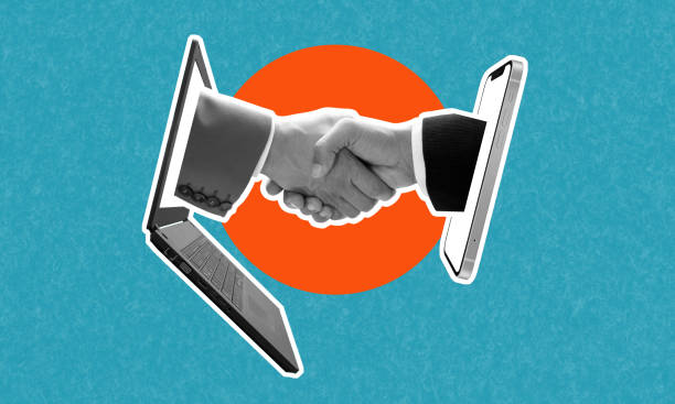istock A transaction between two partners from a laptop and a smartphone. 1484771439