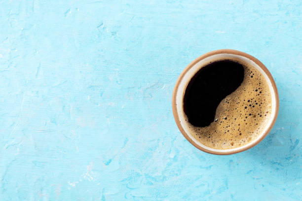 istock Coffee cup, top shot on a blue background with a place for text, espresso 1484777274