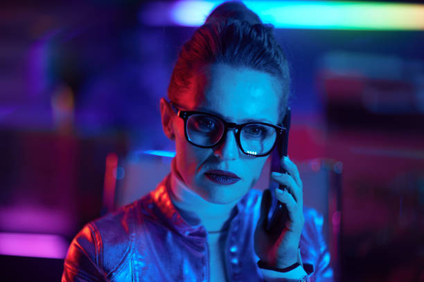 istock pensive trendy woman in glasses using smartphone 1484779036