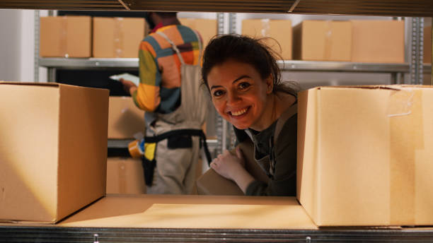 istock Woman employee moving products packages 1484781691