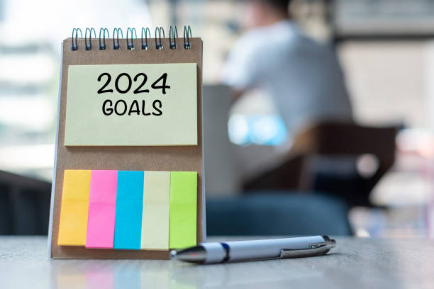 istock 2024 Goal word on note paper with pen on wooden table. Resolution, strategy, solution, goal, business, New Year New You and happy holiday concepts 1484781921
