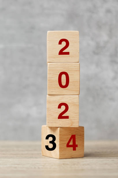 istock block flipping 2023 to 2024 text on table. Resolution, strategy, plan, goal, motivation, reboot, business and New Year holiday concepts 1484782055