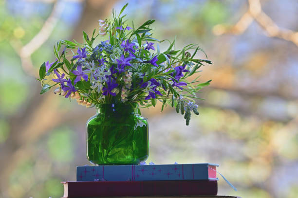 istock Spring Colorful Flowers in Vase near Window 1484782500