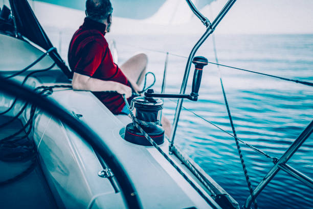 istock Sailing crew member trimming gennaker sail on sailboat 1484785065