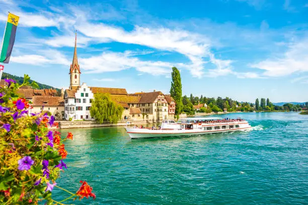Ferry sailing on the river Rhine in Stein am Rhein, Switzerland during a beautiful summer day. The ferry sails over the river Rhine and the Untersse between Schaffhausen and Constance on the shore of the Bodensee