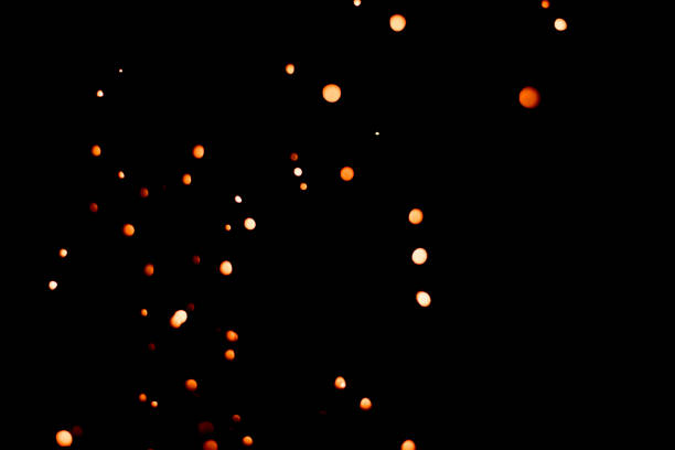 istock Blurred bokeh balls of fire sparks on black background; selective focus; for overlay usage 1484787370