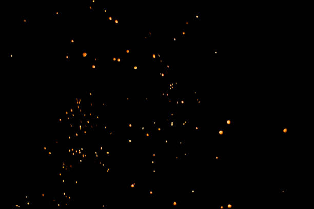 Bunch of fire sparks on black background. Selective focus.