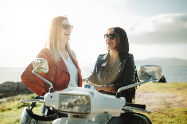 istock Women outdoors with motorbike 1484788465