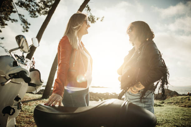 istock Women outdoors with motorbike 1484788467