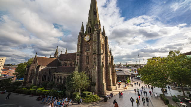 4K Footage Time lapse of Birmingham St Martin church around Bull Ring Shopping Centre with crowd people and tourist walking in the city of Birmingham