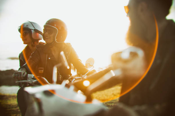 Friends outdoors with motorbike