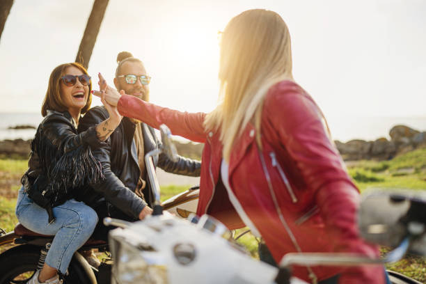 istock Friends outdoors with motorbike high five 1484790518