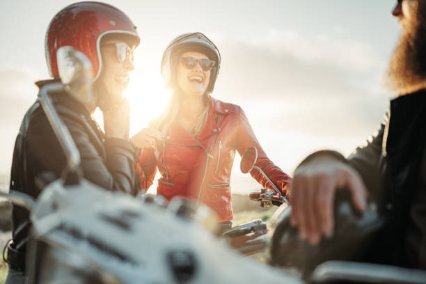 Friends outdoors with motorbike stock photo