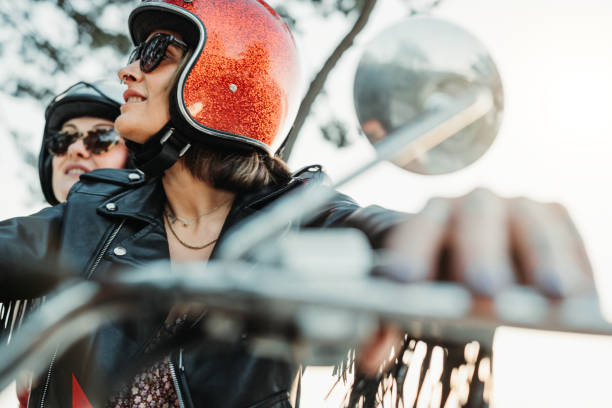 Women outdoors with motorbike stock photo