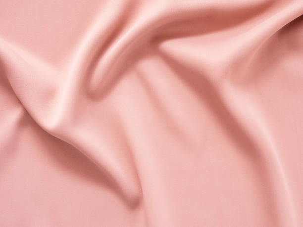 istock Shiny fabric with wavy soft light brown colour. Beautiful smooth elegant wavy, abstract backdrop design. 1484792575