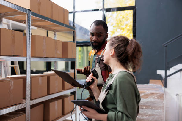 istock Stockroom supervisor showing box with customer order 1484794723