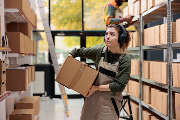 istock Storage room manager looking at shelves full with boxes 1484796580