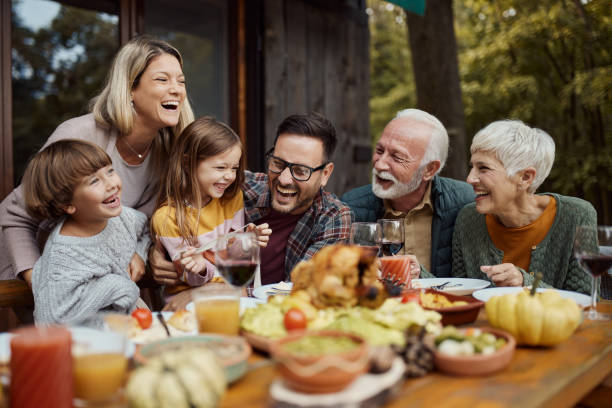 istock Cheerful extended family having fun during lunch on a terrace. 1484798900
