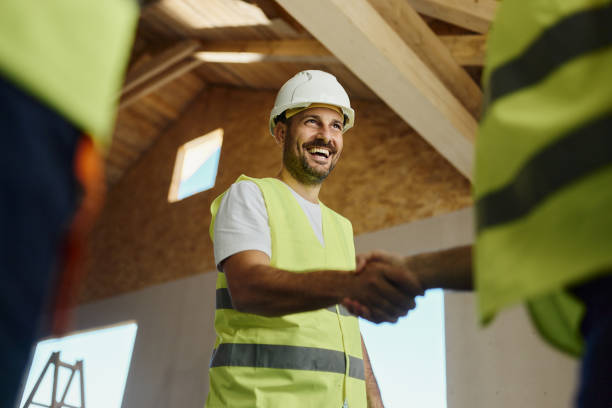 istock Below view of successful agreement at construction site! 1484800672