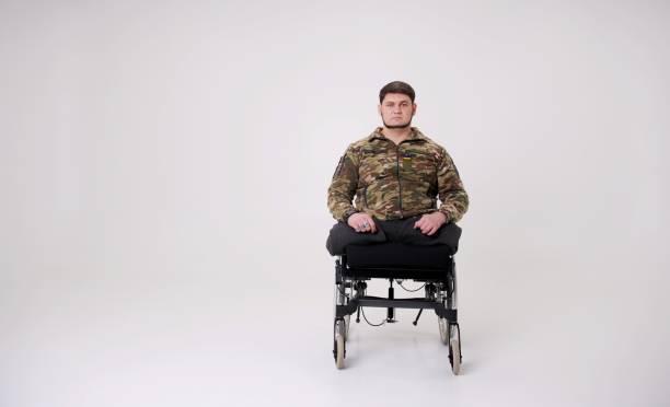 istock strong military man in a chair without limbs prosthetics 1484801649