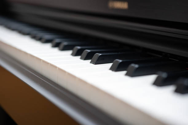 Electronic or acoustic piano keys, no people.