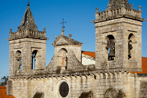 Santo Estevo de Ribas de Sil Monastery church in Ribeira Sacra area in Galicia, Spain.Upper facade, bell towers and roof .