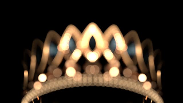 Golden crown with brilliants on black background flowing focus 3D 4K animation