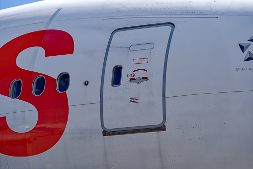 Lettering and door of Swiss Airbus A330-343 HB-JHB stationary at Swiss Airport Zürich Kloten on a sunny spring morning. Photo taken April 14th, 2023, Kloten, Canton Zurich, Switzerland.