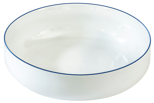 Studio Shot of empty blue rimmed white porcelain Serving Bowl, isolated on white background, side view.