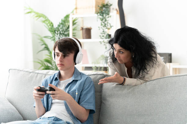 istock Mother trying to talk to son and him ignoring conversation 1484815687