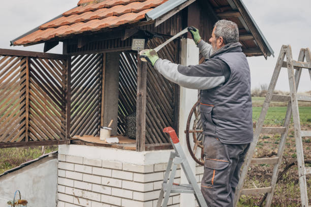 istock An elderly man works in construction, repairing wooden structures 1484815749