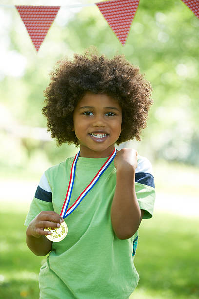 istock Young Boy Winning Medal At Sports Day 148481659