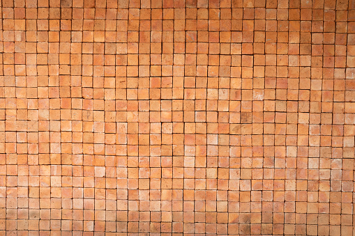 stone brown brick wall texture and background, close up