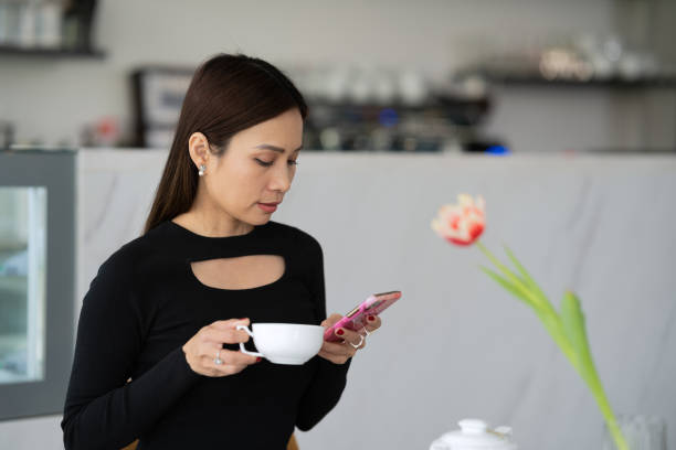 istock A woman drinks coffee in a cafe 1484824750