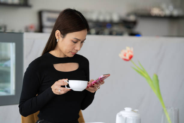 istock A woman drinks coffee in a cafe 1484824756
