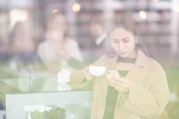 istock A woman drinks coffee in a cafe 1484824770
