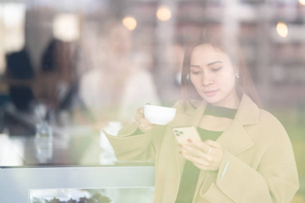 istock A woman drinks coffee in a cafe 1484824775