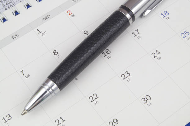 istock Black metal pen on calendar page 1484825911