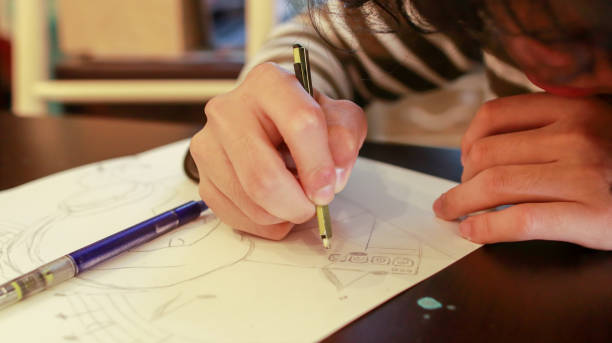 istock An Asian male student at an art school is working on a design assignment 1484827955